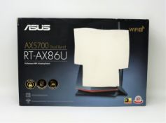 A boxed as new ASUS RT-AX86U AX5700 Dual Band WiFi 6 Gaming Router (Damage to box).