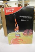 Two boxed as new Microgadgets manual juicers in Orange.