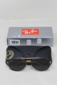 A pair of as new Ray Ban sunglasses.
