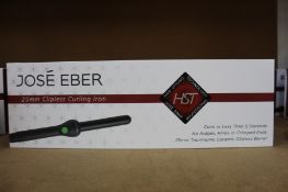 A boxed as new Jose' Eber HST 25mm Clipless Curling Iron (Some minor damage to packaging).