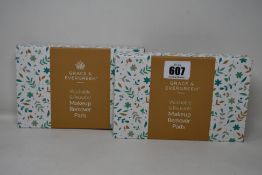 Forty boxed Grace and Evergreen washable and reusable makeup remover pads.