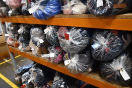 Twelve bags of assorted clothing and related items.