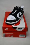 A pair of as new Nike Dunk Low Retro with authentication tag (UK 6).