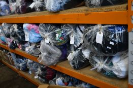 Twelve bags of assorted clothing and related items.