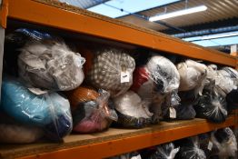 Thirteen bags of assorted clothing and related items.