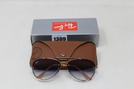 A pair of as new Ray Ban sunglasses.