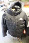 A men's as new The North Face Himalayan light down hoodie jacket (XL).
