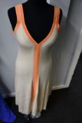 An as new Sandro mid length two tone knit dress (Size 38).