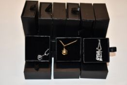 Fifteen items of assorted Haraves jewellery to include 5x silver and 5x gold Globes and 5x Jesus.