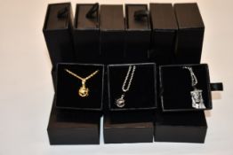 Fifteen items of assorted Haraves jewellery to include 10x Globes and 5x Jesus.