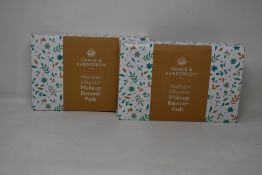 Forty boxed Grace and Evergreen washable and reusable makeup remover pads.