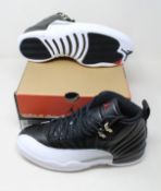 A pair of as new Nike Air Jordan 12 Retro (UK 9).
