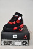 A pair of as new Nike Jordan 4 Retro with authentication tag (UK 6).
