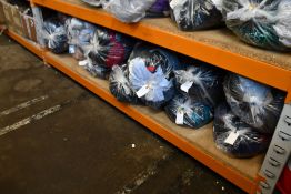 Twelve bags of assorted clothing and related items.