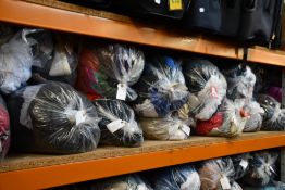 Fourteen bags of assorted clothing and related items.