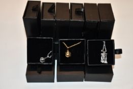 Fifteen items of assorted Haraves jewellery to include 5x silver and 5x gold Globes and 5x Jesus.