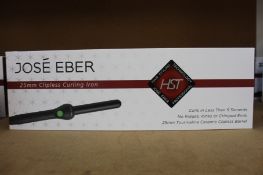 A boxed as new Jose' Eber HST 25mm Clipless Curling Iron.