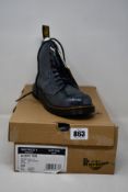 A pair of youths as new Dr Martens Pascal boots in grey leather (UK 4).