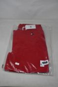 A pair of as new Tommy Hilfiger Herren equestrian breeches in primary red (L - RRP €199).