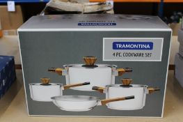 A boxed as new Tramontina four piece cookware set.