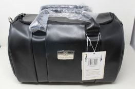 An as new Nova Harley Manhattan blackberry leather changing bag.