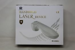 A boxed and sealed as new RK-6000HL handheld cold laser therapy device.