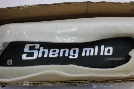 A Sheng Milo 48V 17.4Ah Lithium ion battery with pair of keys.