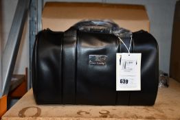 An as new Nova Harley Manhattan blackberry leather changing bag.
