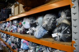 Thirteen bags of assorted clothing and related items.