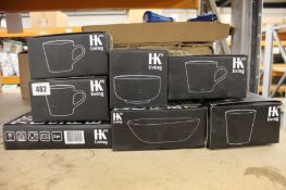 A quantity of HK Living plates, bowls and mugs.