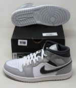 A pair of as new Nike Air Jordan 1 Mid (UK 7).