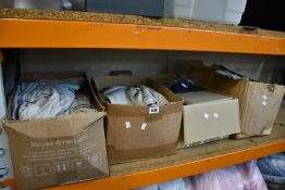 Four boxes of as new clothing and related items.