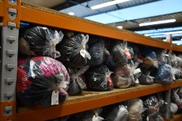 Fourteen bags of assorted clothing and related items.