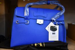 An as new Nova Harley Luxury Elegant Blue leather changing bag.