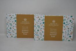 Forty boxed Grace and Evergreen washable and reusable makeup remover pads.