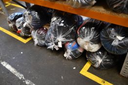 Thirteen bags of assorted clothing and related items.