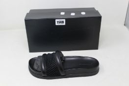 A pair of as new Alexander Wang slides in black (EU 39).