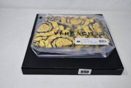 A pair of as new Versace swim shorts (EU L/GB 36).