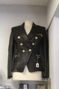 A women's pre-owned Balmain double breasted leather blazer (Size 36, excellent condition).