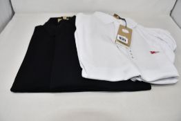 Three as new Burberry polo shirts; two in black (XL) and one in white (L - RRP £79 each).