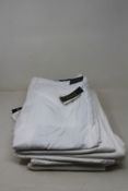 Six pairs of as new Ralph Lauren pants in white (Assorted sizes).