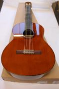 A Yamaha CS40//02 Classical Guitar.