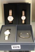 Two as new Daniel Wellington watches and a gift set of watch and bangle.