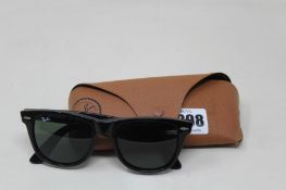 A pair of as new Ray Ban sunglasses.