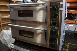 A pre-owned Roller grill double deck pizza oven.