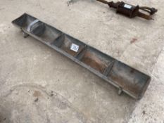 Metal feed trough