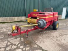 1993 New Holland 570 conventional baler with 65