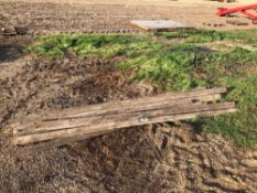 Quantity half round wooden fence rails