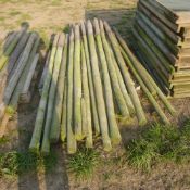Pallet of round fencing posts