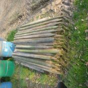 Pallet of used round fencing stakes, approx.